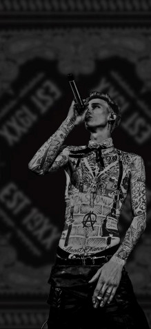 Machine Gun Kelly iPhone 13 Mini Wallpaper 1080x2340px